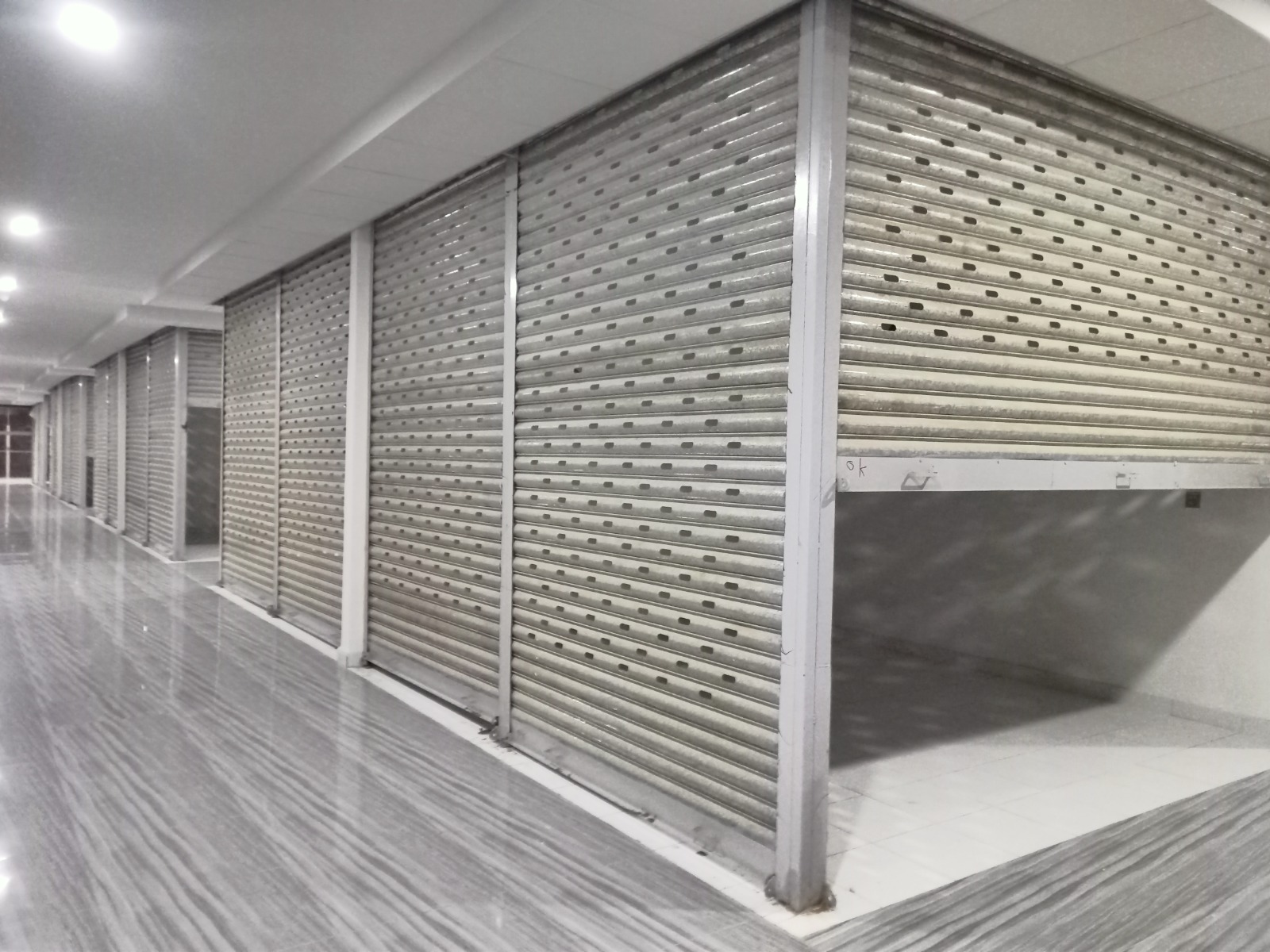 Mall Perforated Shutters – AQ Builders, Bahria Town Karachi